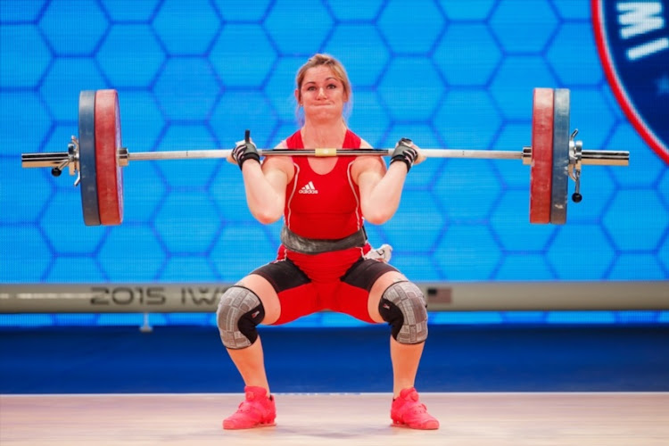 Mona Pretorius of South Africa competes in the women's 63kg weight class during the 2015 International Weightlifting Federation World Championships at the George R. Brown Convention Center on November 25, 2015 in Houston, Texas.