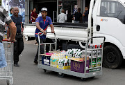 A Durban man stocks up on alcohol ahead of the lockdown. 