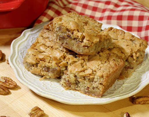 Slices of Sweet Alabama Pecan  Bread on a white plate.