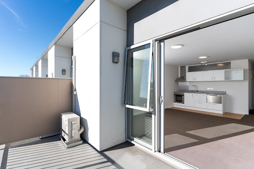 Buy this luxury house in Christchurch (New Zealand) - Modern balcony overlooking white kitchen