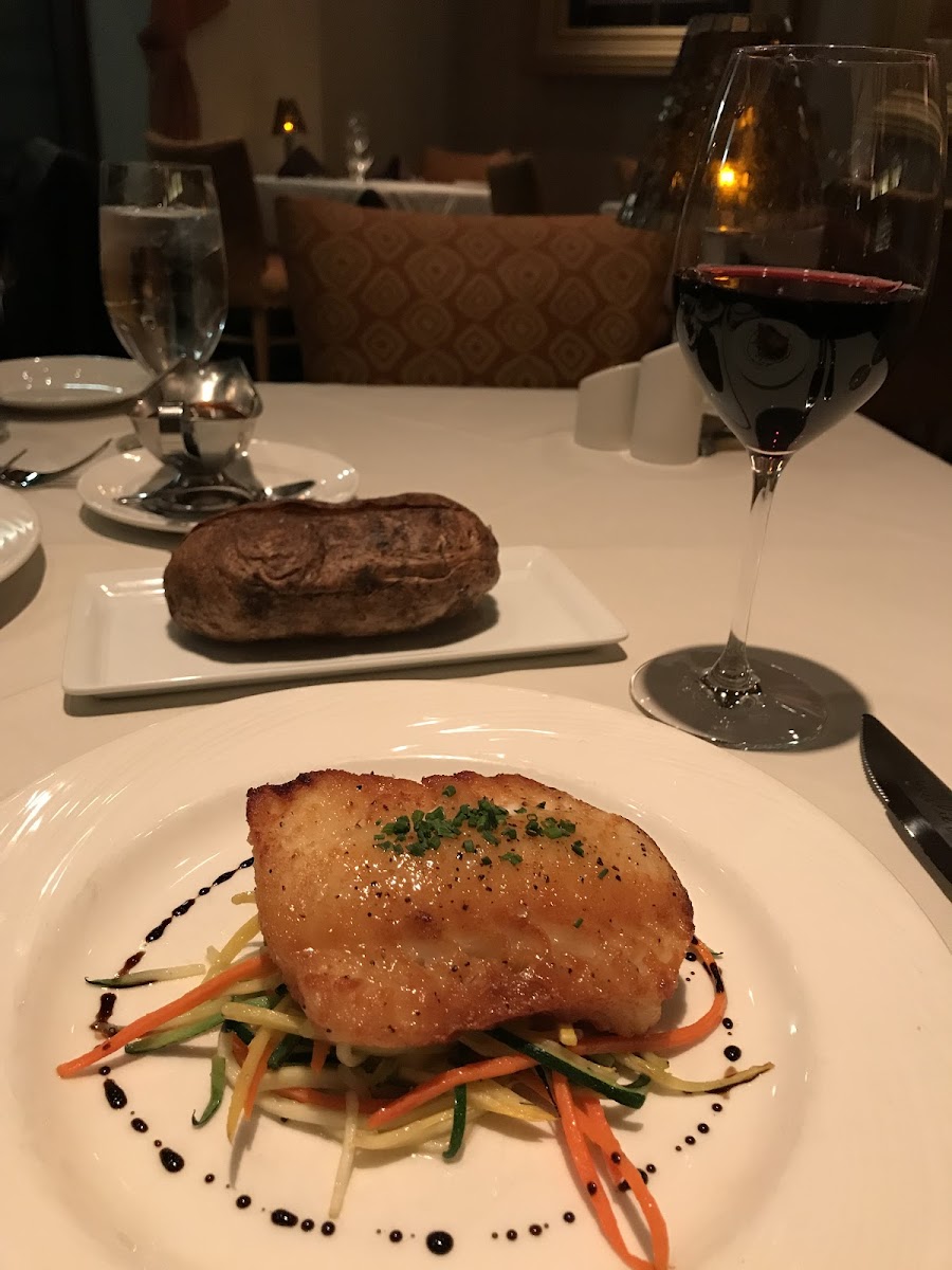 pan seared sea bass with julienned veggies and a baked potato