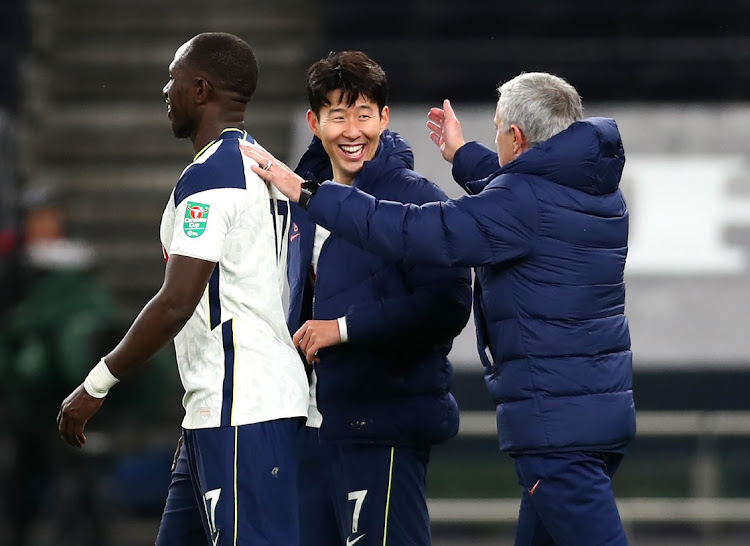 Tottenham manager Jose Mourinho celebrates with goal-scorers Son Heung-Min and Moussa Sissoko following the Carabao Cup semifinal victory over Brentford at Tottenham Hotspur Stadium on January 5, 2021 in London