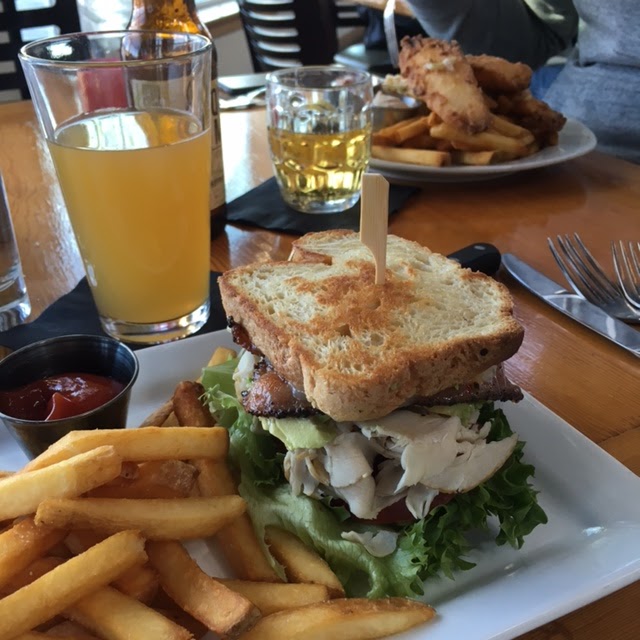 Turkey/bacon/avocado sandwich and GF Battered cod in the background.