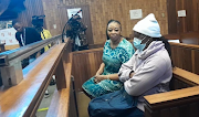 Convicted serial killer Rosemary Ndlovu sits beside her co-accused Nomsa Mudau in a new trial in which they are charged with incitement and conspiracy to commit murder. 