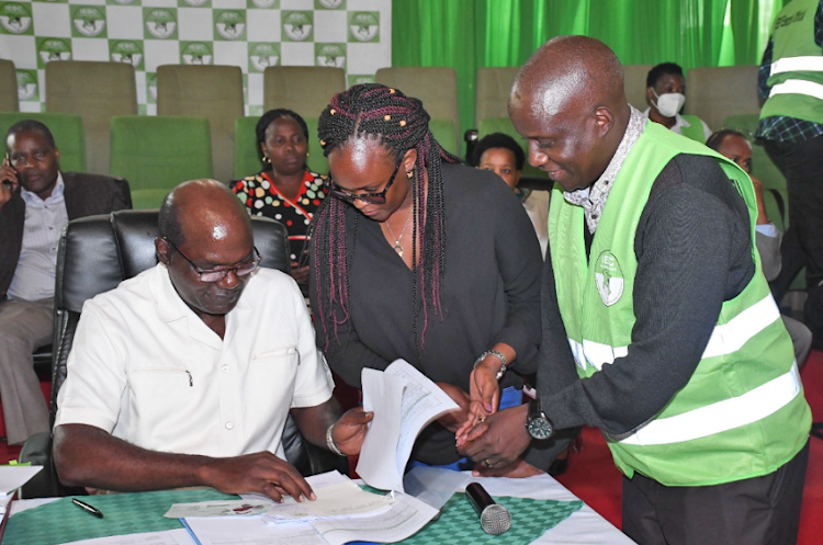 IEBC chairman Wafula Chebukati with some of returning officers for the presidential election presiding over registration of candidates for the general election from May 29 until Monday, June 6.