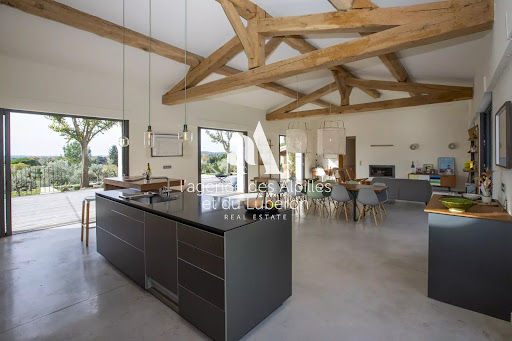 Modern kitchen with open central island - Buy this luxury property in Maussane-les-Alpilles, 12 rooms, 6 bedrooms