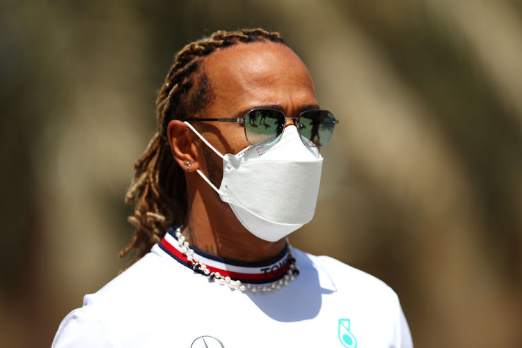 Lewis Hamilton walks in the Paddock before practice ahead of the F1 Grand Prix of Bahrain at Bahrain International Circuit on March 18, 2022 in Bahrain.