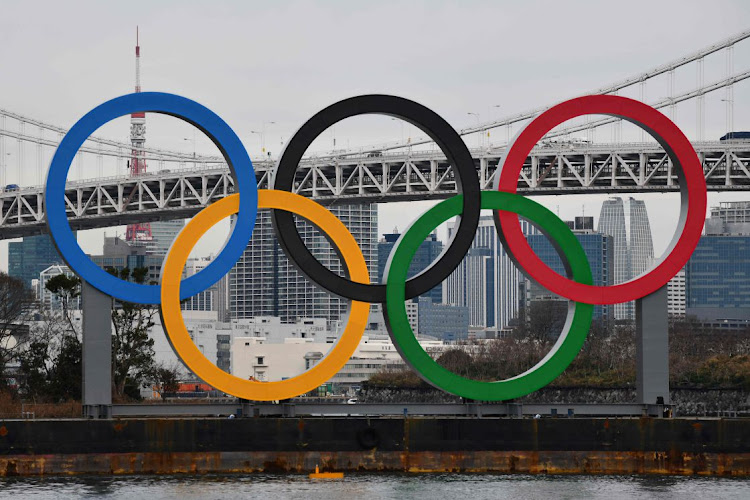 In this file photo taken on January 17, 2020 a large size Olympic Symbol (W32.6m x H15.3m) is brought by a salvage barge to install at Tokyo Waterfront, in the waters of Odaiba Marine Park.