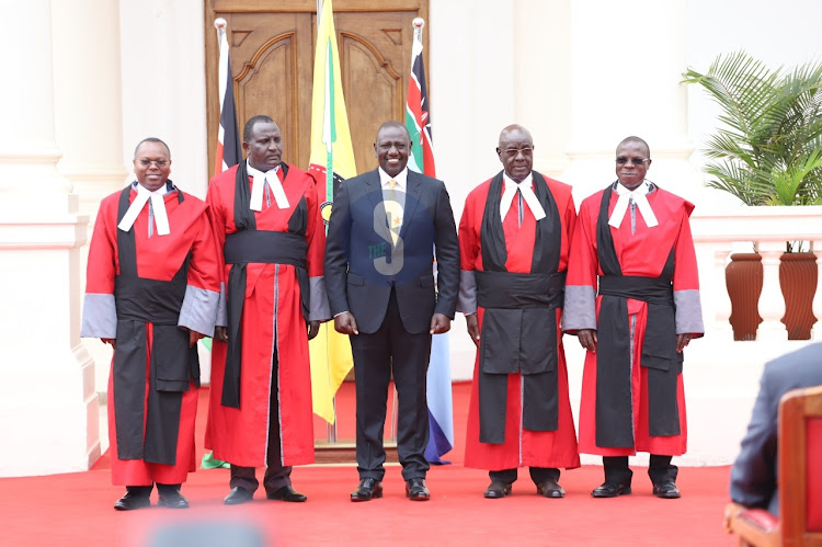 President Dr William Ruto with sworn-in of Judges of Court of Appeal from left Justices Joel Ngugi, Weldon Korir, Aggrey Muchelule and George Odunga at State House, Nairobi on September 14, 2022.