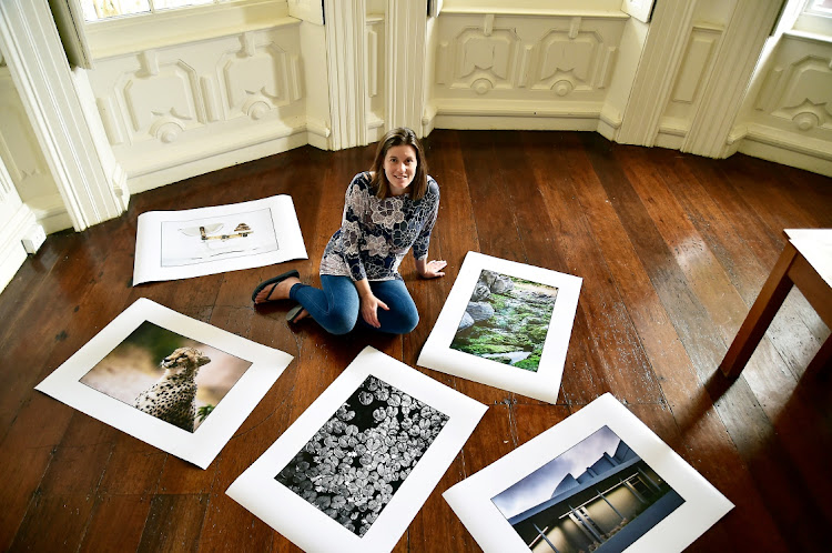 Co-ordinator Roxane van Wyk of NMU with some of the work done by students who completed the short courses in photography offered by the university. The works will be exhibited from March 3-18 at the NMU Bird Street Gallery in Central