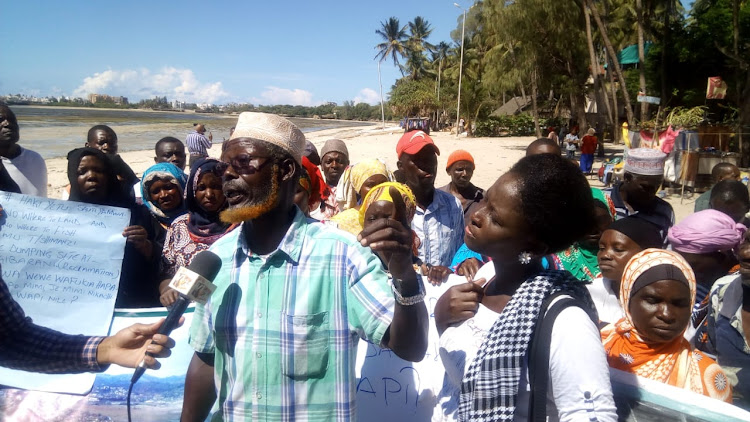 Mombasa fishermen address the press at Jomo Kenyatta Public Beach on Thursday