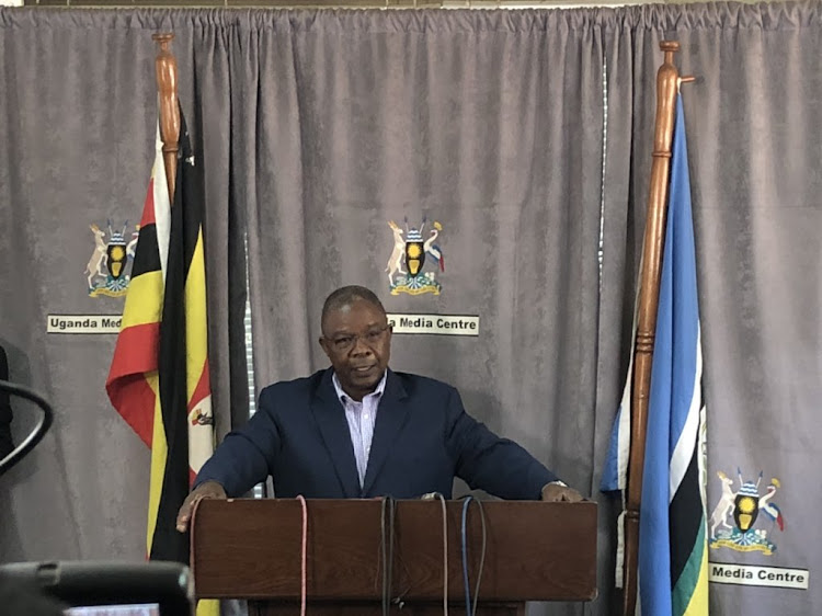 Minister for Karamoja Affairs John Byabagambi addresses the press on Tuesday, March 19 after police said they are investigating a supply of food from the World Food Programme after three people died and 262 others got sick.