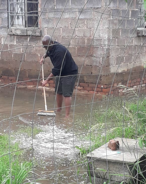 A resident mops up after heavy rain hit parts of Pietermaritzburg at the weekend.
