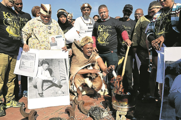 Members of the Khoi and San communities in Nelson Mandela Bay burn their ID books in July 2018, saying they reflect apartheid-era racial classifications.