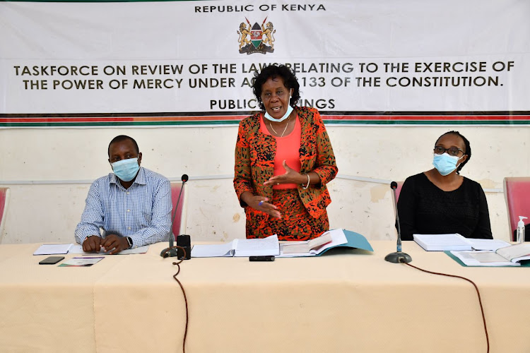 POMAC CEO Lydia Muriuki flanked by Garissa deputy county commissioner Bernard ole Kipury and Ann Okutoyi, a ommittee member