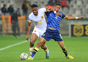 Siyabonga Ngezana of Kaizer Chiefs and Wayde Lekay of Cape Town City contest the ball in the DStv Premiership game at Cape Town Stadium on Tuesday.