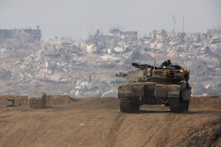 An Israeli tank at the Israel-Gaza border. Picture: AMIR COHEN/REUTERS