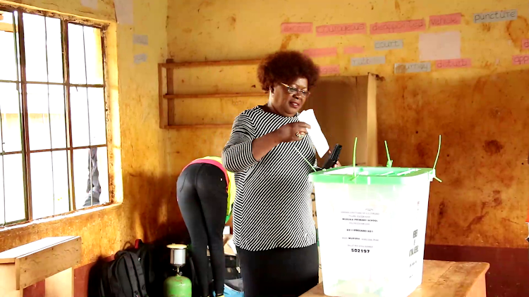 Water Cabinet Secretary Alice Wahome casting her vote at Muruka primary school polling centre in Kandara constituency.
