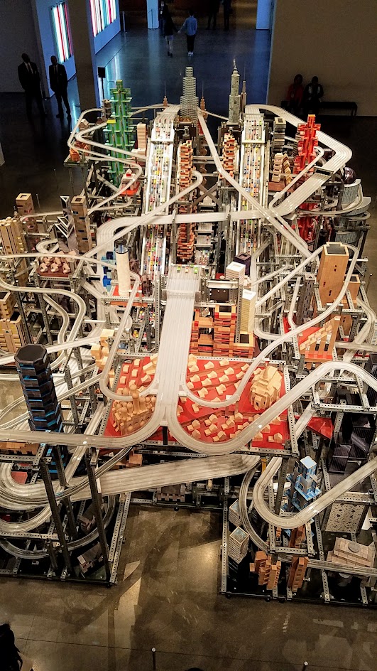 If you buy your LACMA museum admission, there is another Chris Burden exhibit you can view inside one of the building Broad Contemporary Art Museum. This is Metropolis II, also a sculpture but a kinetic one. Some of the times, it is a mini city, frozen in time with a 1,100 Hot Wheel Cars and Miniature trains on bridges and roads throughout the multiple levels.