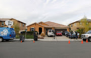 Members of the news media are parked outside the home of David Allen Turpin and Louise Ann Turpin in Perris, California, U.S. January 15, 2018. 