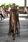 A model presents a creation from the Valentino Spring/Summer 2021 women's and men’s collection in Milan, Italy.