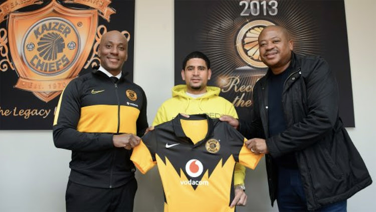 Kaizer Chiefs sporting director Kaizer Motaung Jnr, left, welcomes new signing Keagan Dolly, with football manager Bobby Motaung.