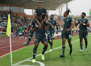 Nigeria striker Kelechi Iheanacho celebrates with teammates after scoring the solitary goal.