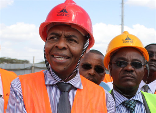 Former Roads CS Michael Kamau at the construction site of the passenger terminal at JKIA on September 25.Photo/File