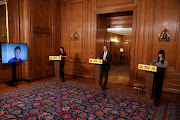 Britain's Health Secretary Matt Hancock, Britain's Deputy Chief Medical Officer for England Jenni Harries and Healthcare Epidemiologist Consultant Susan Hopkins attend a news conference on the ongoing situation with the coronavirus disease (Covid-19), at Downing Street in London, Britain, January 25, 2021. 