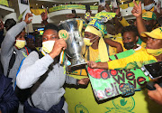 Players Zanele Ndlapho, Andisiwe Mgcoyi and fans during the Mamelodi Sundowns Ladies team arrivall at OR Tambo International Airport in Johannesburg. 