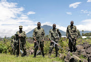 Members of the Ugandan army, part of the troops assigned to the East Africa Community Regional Force, stand at a settlement ceded by M23 rebels fighters to EACRF soldiers in Bunagana, Rutshuru territory of the North Kivu province of the DRC on April 19 2023. File photo.