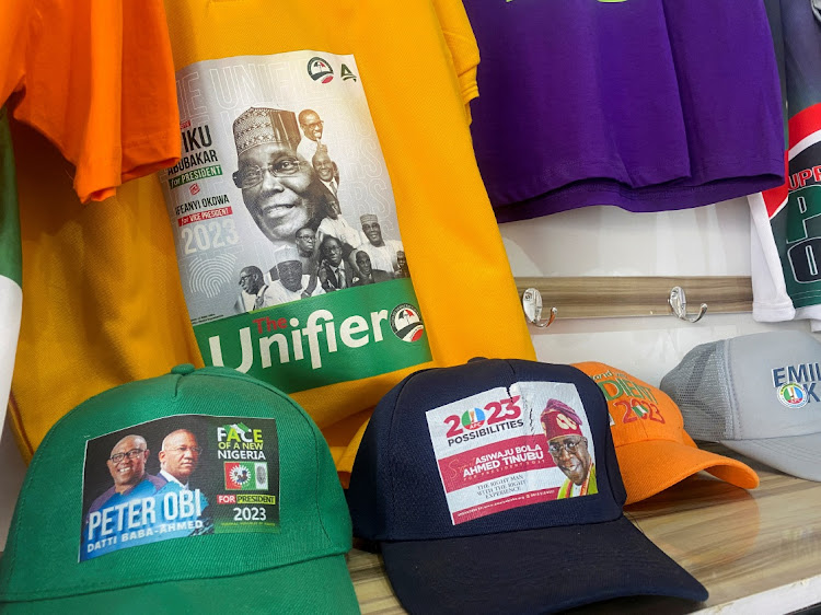 Branded T-shirts and baseball caps with images of Nigerian presidential candidates at a shopping centre in Abuja, Nigeria in February 2023.