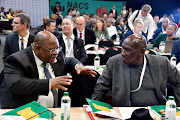 Chief justice Raymond Zondo speaks to police minister Bheki Cele at the National Anti-Corruption Advisory Council two-day dialogue.