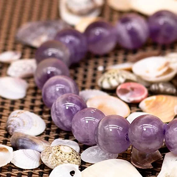 Handgemaakte elastische armband met natuurlijke tijgeroog en turkoois kralen. Bescherming en stijl.