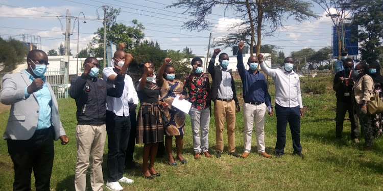 Health unions' officials sing solidarity song at the Mbagathi Hospital in Nairobi on December 10, 2020