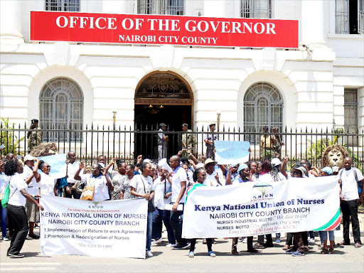 Nurses demonstrate outside Nairobi county offices yesterday/EZEKIEL AMING'A