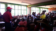 William Mabaso of Kwadedangendlale High School’s School Governing Board leads a discussion on the problems with the school’s infrastructure. 