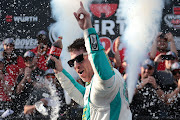 Denny Hamlin celebrates in victory lane after winning the NASCAR Cup Series Würth 400 at Dover International Speedway on April 28 2024 in Dover, Delaware.