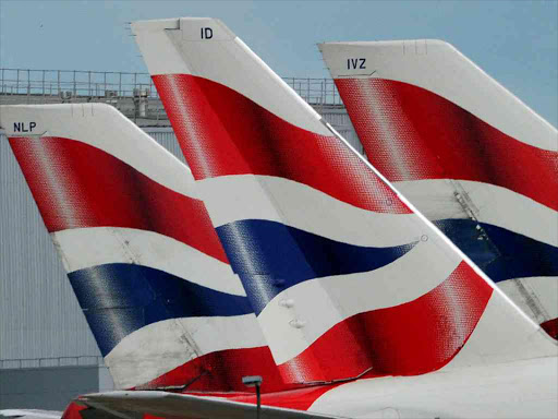 British Airways logos are seen on tailfins at Heathrow Airport in west London, Britain May 12, 2011. REUTERS/Toby Melville/File Photo