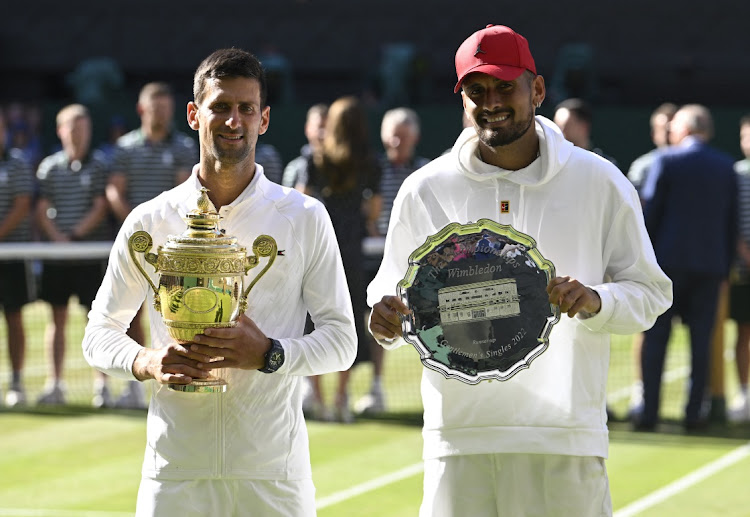 Serbia's Novak Djokovic poses with the trophy after winning the men's singles final alongside runner-up Australia's Nick Kyrgios at Wimbledon in London, July 10 2022. Picture: TOBY MELVILLE/REUTERS