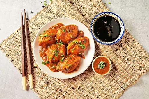 Chicken Pan Fried Momo In Tomato Garlic Sauce