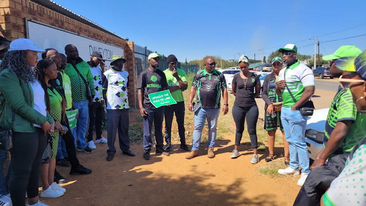 ActionSA members outside the Daveyton magistrate court on the East Rand where a facing several rape charges appeared.