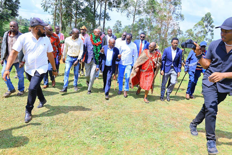 Media Personality Stephen with Narok Governor Patrick Ole Ntutu and other guests during his Thanksgiving ceremony at Enooretet Village in Narok County on October 13, 2023.