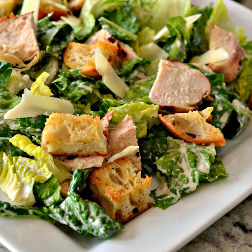 Chicken Caesar Salad brings it all together with crisp romaine, tender grilled chicken, lightly seasoned homemade croutons, shaved Parmesan and tangy Caesar Dressing. 