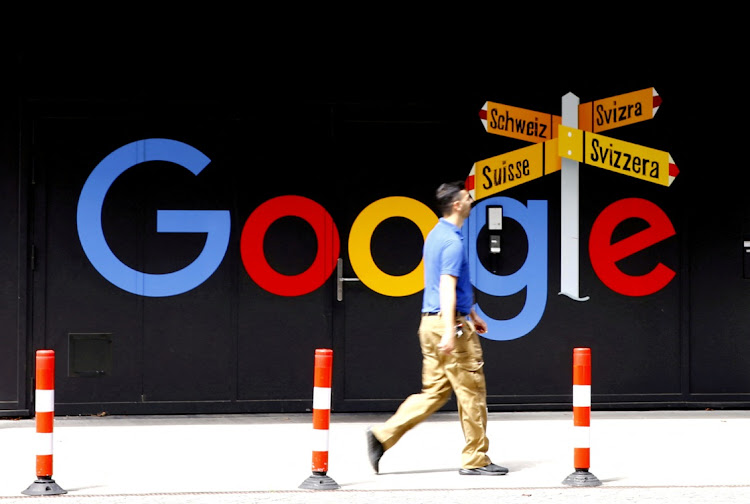 A man walks past a logo of Alphabet Inc's Google in front of an office building in Zurich, Switzerland July 1, 2020. Picture: REUTERS/ARND WIEGMANN/FILE PHOTO