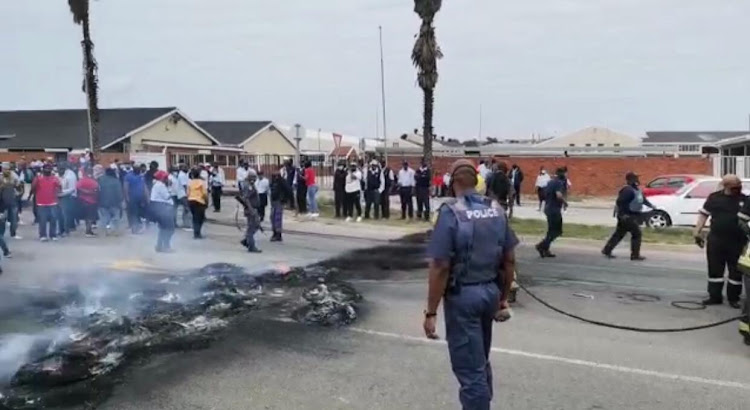 Angry bus drivers burnt tyres and protested outside the Algoa Bus Company offices on Friday morning, demanding short-time pay