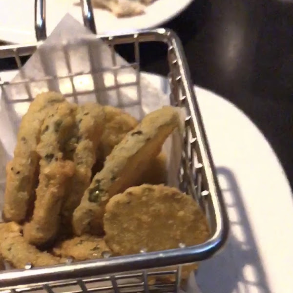 Gluten free fried pickles appetizer. (Blurry cause it was from a video I took sorry!) Came with 2 dipping sauces and a wood pick that said “allergy” on it