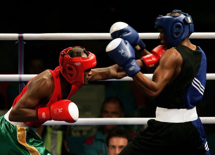 Bongani Mwelase, left, won gold at the 2006 Commonwealth Games in Melbourne, making him South Africa's most successful amateur fighter since readmission.