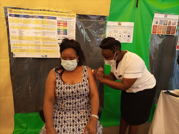 Kitui County Health executive Winnie Kitetu gets vaccinated against Covid-19 during the launch of the exercise on March 10.