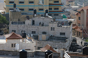 Israeli forces are seen on the top of the family house of Arab gunman Diaa Hamarshah who carried out a shooting attack in a Tel Aviv suburb, during a raid near Jenin in the Israeli-occupied West Bank March 30, 2022. 
 